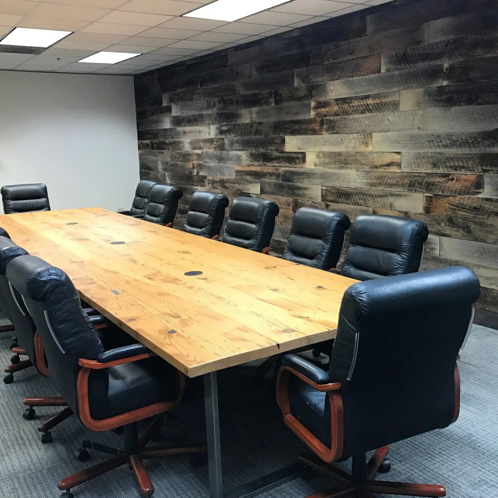 Conference room table office chairs rustic reclaimed wood wood wall paneling