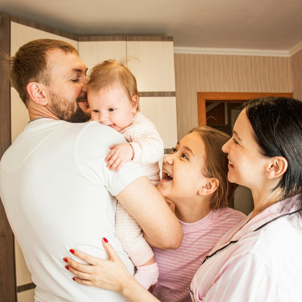 Happy family at home laughing together,real life, home comfort, two generations,