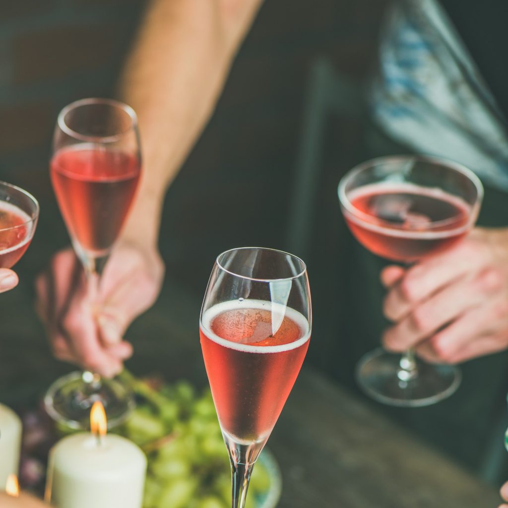 People having party, gathering, celebrating with rose champaign, square crop